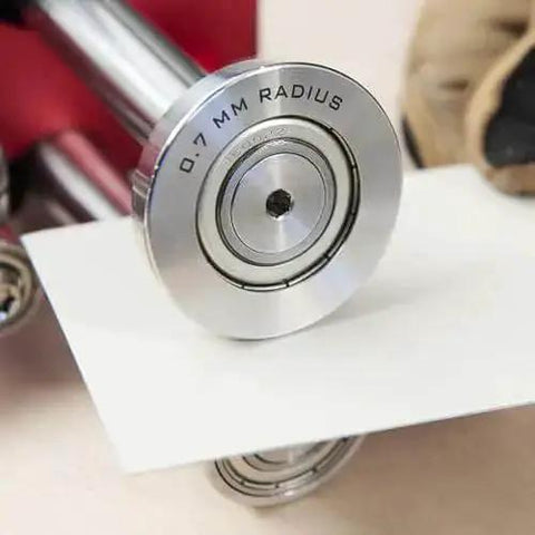 Close-up of Two Station Metal Bender Pro Grade for precise bends under 150mm, adjustable roller spacing from 0.5mm to 1mm.