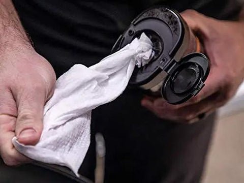 Person holding a dispenser showing a large white leather wipe from Gold Class Leather Wipes For Cars All In One Leather Cleaner Conditioner And Protector With Aloe Moisturizers 25 Large Wipes Winter Ready Car Care Essentials.