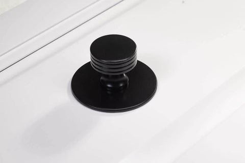 Matte Black Escutcheon Back Plates For Cabinet Knobs And Doors Four Pack Round Rosette Plate Two And One Third Inch Heavy Duty Die Cast Zinc Ideal For Bifold Closet Doors Door Pulls And Handles installed view