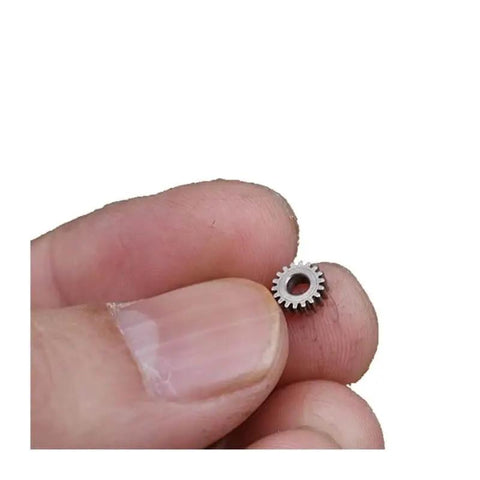 Close-up of 0.3 Module Planetary Gearbox Gear with 5.95 mm diameter and 2.55 mm inner hole, showing 18 teeth for DIY robotics.