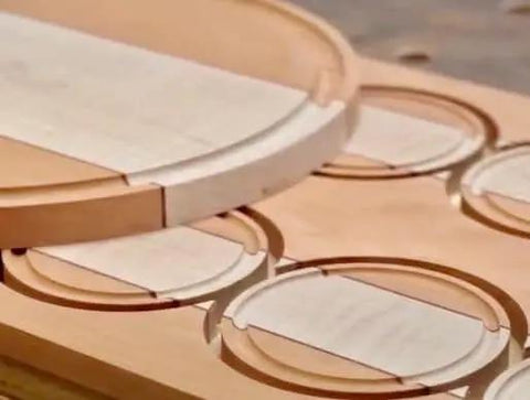 Close-up of wood cutouts made by Grade A Circle Jig For Woodworking Delivers 268 Circle Cuts From One And A Half Inches To Eighteen And Three Sixteenths Inches In One Sixteenth Increments Compatible With Standard And Pro Router Models Killer For Speaker Cutouts Rings And Inlays Works.