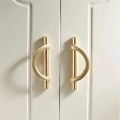 Brushed Gold Half Moon Cabinet Pulls installed on white cupboard doors, Set of 2, 3.75 Inch Length, Durably crafted from Zinc Alloy, Rust Resistant.