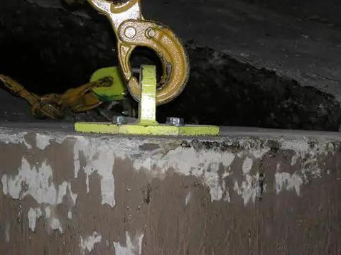 Heavy-Duty Screw Anchor THD37212H Three-Eighths Inch By Two And One-Half Inch installed in concrete, showing chain attachment.