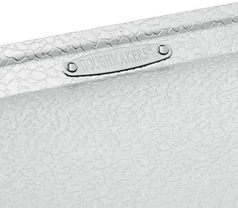 Close-up of the Pro Grade Aluminum Bake Pan 10 By 14 Inch Pebble Pattern for even browning and quick airflow.