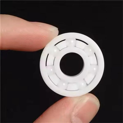 White 608 bearing ring with six pockets, inner bore visible, 8x22x7mm skateboard part
