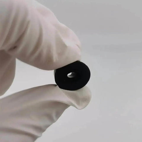 Close-up of a black silicone spacer from the 12Pcs Silicone Bed Spacers And Mounts For 3D Printers Easy Bed Leveling Kit.