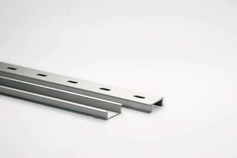 Heavy Duty Aluminum Slotted DIN Rail One Meter Long 35x10 mm 1.5 mm Thick Silver With Corner Mount Anodized Aluminum Construction And 6.2x15 mm Slots On 50 mm Centers, shown at an angle