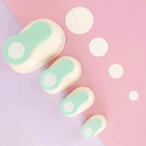 Set of four turquoise circle hole punches with cut-out circles for crafts, featuring the Three Inch Circle Hole Punch With Lever For Precise Clean Cuts Great For Scrapbooking Cards Journals And DIY Paper Crafts Super Handy Compact Round Punch For Cardstock On The Go.