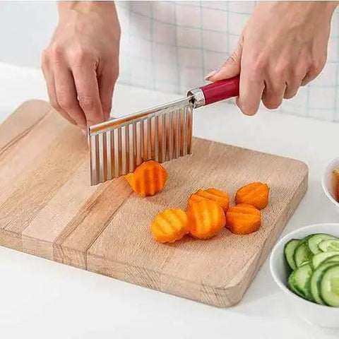 Crinkle Cut Potato Cutter Knife Stainless Steel Wave Slicer for potatoes, carrots in slicing action on a wooden board.