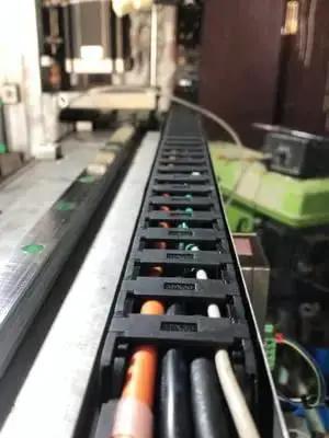Open Type Drag Chain Cable Carrier with End Connectors 40x100mm Inner Size, 1 Meter Length, installed on CNC machine.