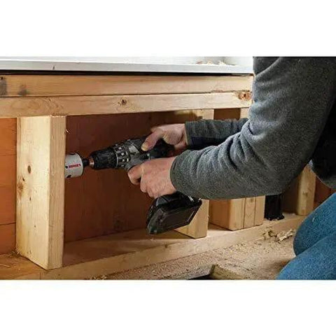 Person using Bi Metal Hole Saw Kit For Wood And Metal, T3 Electricians And Plumbers Kit, 13 Piece Set With 9 Hole Saws, 2 Arbors, And 2 Pilot Bits