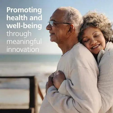 Couple embracing at beach with text 'Promoting health and well-being through meaningful innovation'