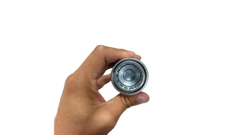 Hand holding Hydraulic Quick Connect Set AG ISO 5675 Pioneer Style Pro Grade Coupler with red dust cap removed, front view.