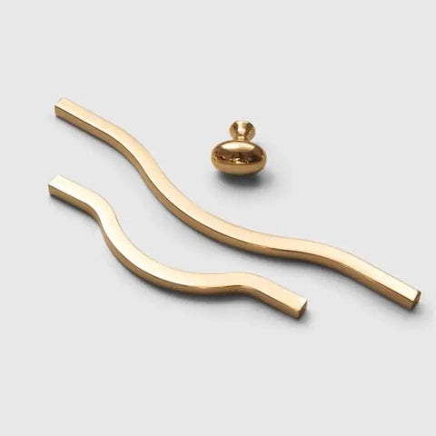 Golden Wave Shaped Cabinet Pulls Set Of 6 With Glossy Cupboard Drawer Knobs in gold aluminum, wave style on white background.
