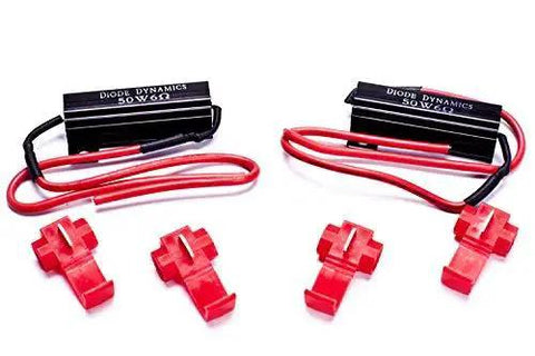 Diode Dynamics LED resistor kit pair with two black 50W resistors and red wiring; front view