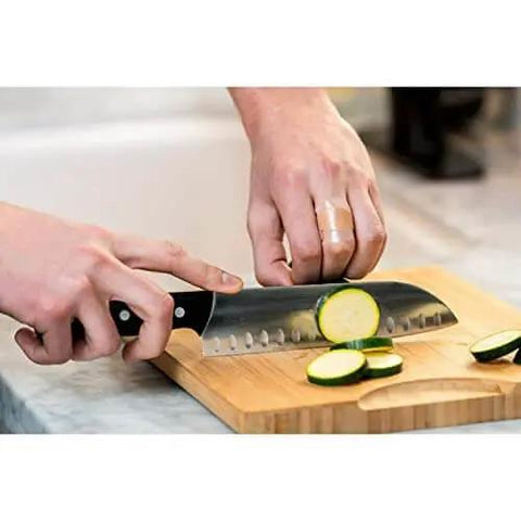 Person chopping zucchini wearing Waterproof Clear Bandages Assorted Sizes 100 Count With 360 Degree Seal Around The Pad