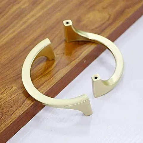 Two Pair Cabinet Hardware Handles In Golden Copper Brushed Gold Finish With Double Hole Mounting shown on wooden surface.