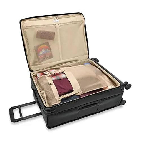 Large 29 Inch Expandable Spinner Checked Luggage For Travel With One Touch CX Compression And Four 360 Spinner Wheels Softside Rolling Bag For Men And Women Self Repairing Zipper Baseline Collection Black Briggs And Riley open view showing packed interior.