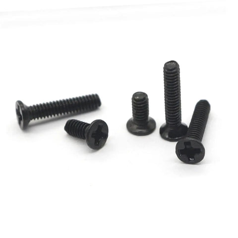 Black flat-head screws from the Miniature Screw Set With 18 Sizes, ideal for DIYers, plumbers, and assembly pros, pictured in close-up.