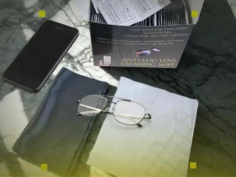 Anti Fog Eyeglasses Cleaning Wipes And Microfiber Cloth For Glasses Screens with glasses and smartphone on table