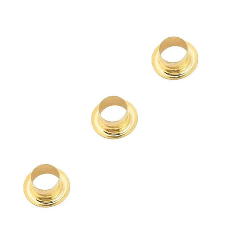Three gold grommets from the DIY Eyelet Setting Tool Pliers Kit With 100 Gold Grommets, ideal for crafts and DIY projects.