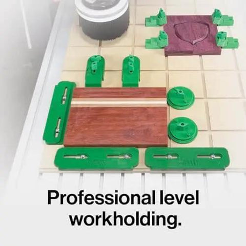 MatchFit CNC Clamping Kit For Woodworking And Milling, 11 Piece Green Set shown installed on wood for clamping.
