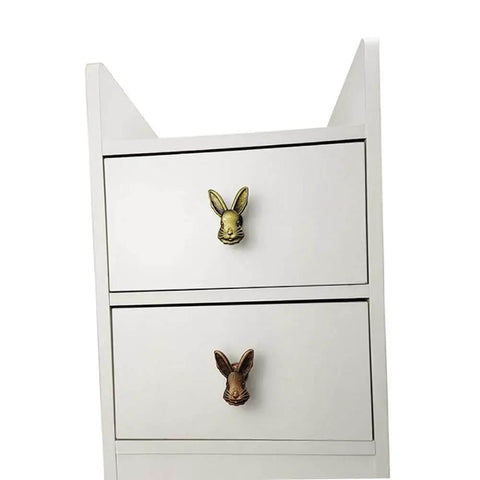 White dresser with Cute 4 Pack Rabbit Drawer Knobs With 3D Bunny Head Design For Kids Rooms And Furniture Zinc Alloy Decorative Cabinet Pulls With Antique Finish Bolwhao in black and gold.