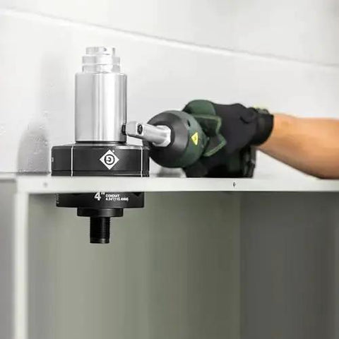 Using 11-Ton Battery Hydraulic Knockout Punch Kit with Slug Buster for 1/2 to 4 inch conduit on metal sheet