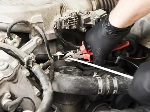 Mechanic wearing Black Nitrile Gloves 5 Mil For Cooking Food Prep Disposable Large Box Of 100 using pliers on car engine