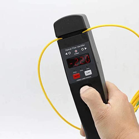 Optical fiber identifier handheld tool with built-in VFL, yellow fiber cord looped around digital display