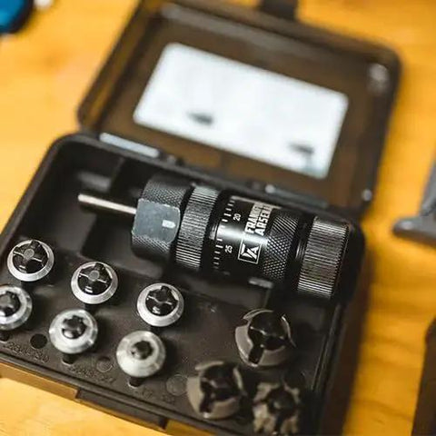 Pro Grade Universal Precision Case Trimmer For Reloading With HSS Construction And Drill Press Or Hand Drill Compatibility Depth Micrometer For Micro Adjustments Brass Shaving Ejection Port Universal Collet System And Storage Case By Frankford Arsenal displayed in open case with collets