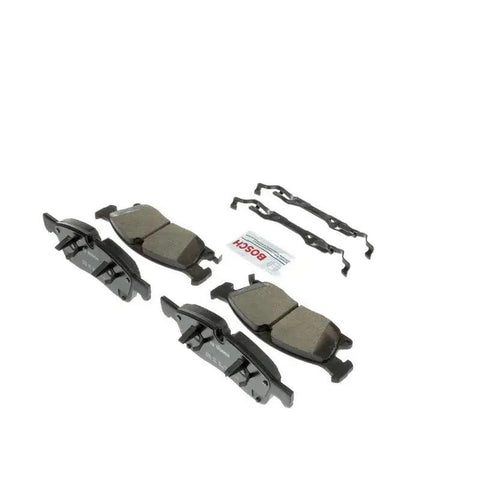 Bosch BC1904 front ceramic brake pad set with four pads, mounting clips, and grease packet