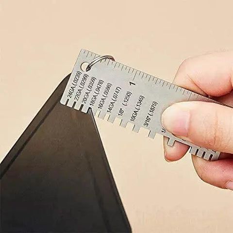 Versatile Metal Thickness Gauge For Welding And Sheet Metal, stainless steel, in use measuring a metal sheet, portable pocket size.