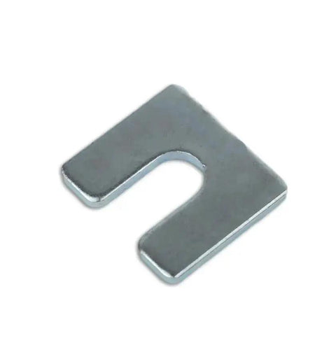 Close-up of a 1/8 inch steel shim with a 3/8 inch slot. Part of the Beefy One Eighth Inch Steel Shim Stock With Three Eighth Inch Slot Width Pack