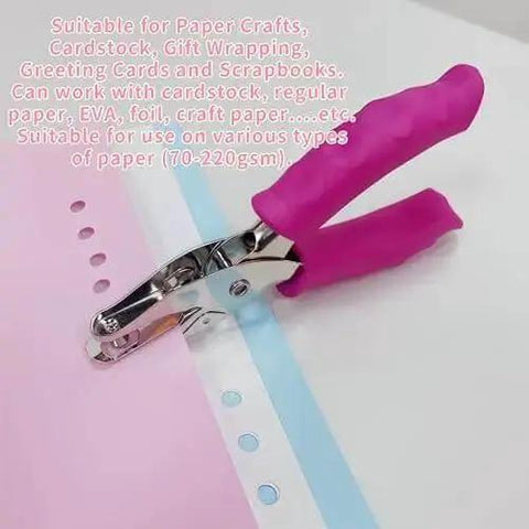 1/4 Inch Pink Handheld Circle Hole Punch For Crafting with pink handle, shown punching holes in cardstock for scrapbooking projects