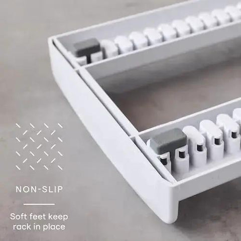 Close-up of StoreMore Adjustable Bakeware Rack With Steel Wires Seven Adjustable Dividers showcasing non-slip base feature.