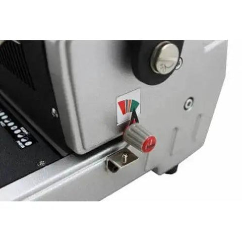 Close-up of CoilMac-ER Plus Manual Coil Punch With Electric Inserter, showcasing a control knob and part of the machine's metal body.