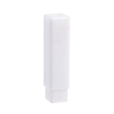 Rectangular white solid object with textured surface, upright position.
