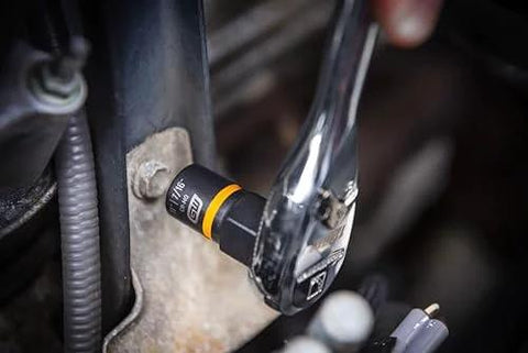 Seven Piece Metric Bolt Biter Extraction Socket Set With One Quarter And Three Eighths Inch Drive installed on a ratchet