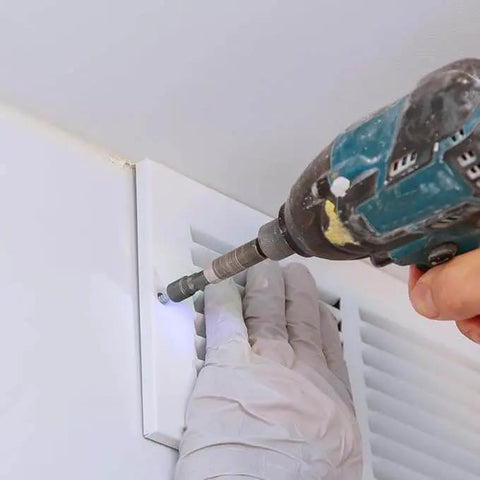 Using 14 Piece Power Nuts Driver Drill Bit Set With Metric Sockets And Wrenches to install a vent cover, showing hex driver in use.