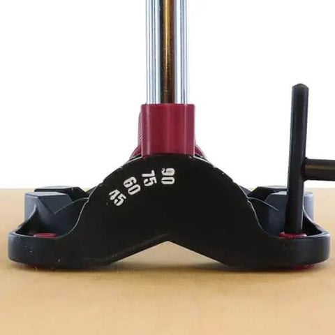 Portable Drilling Guide Attachment For Straight And Angled Holes With Adjustable Angle Readout shown on wood surface