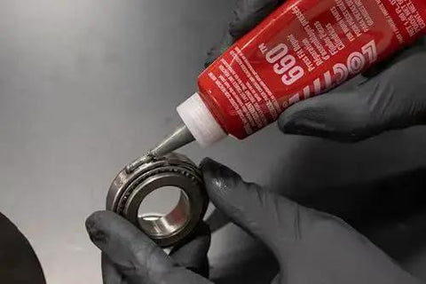 Applying Shop Grade Automotive Press Fit Repair Adhesive For Worn Parts With High Strength Quick Cure to a bearing, 50 ml bottle