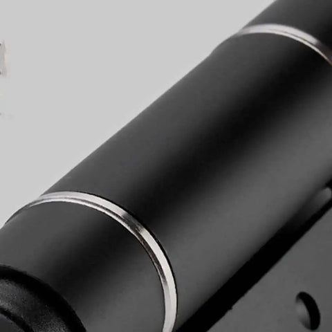 Close-up of Invisible Door Hinge With Automatic Closer And Hydraulic Spring Damping, sleek black finish for cabinets and furniture.