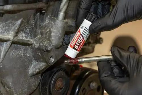 Applying Red High Strength Threadlocker Stick With Power Bond For Heavy Duty Fasteners, Wax Based Adhesive For Max Hold In High Temps