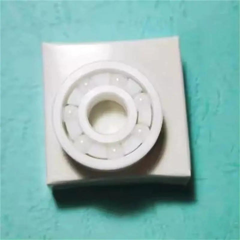 All Zirconia Ceramic Fishing Reel Bearing 623CE 3x10x4 Mm ABEC 9 Zirconia ZrO2 With PTFE Oxide Races on turquoise surface