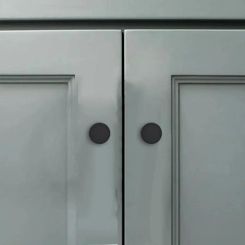 18 Pack 1-1/5 Inch Matte Black Round Cabinet Knobs Zinc Alloy Heavy Duty Pulls shown on grey cabinet doors