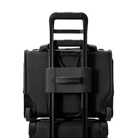 Rear view of Baseline Carry On Bag With Smooth Roll 2 Wheel Mobility Softside Luggage showing interlocking handle and sturdy construction.