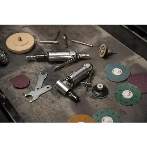 Lightweight One Quarter Inch Right Angle Air Die Grinder With Twenty One Thousand RPM, Ball Bearing Construction, Aluminum Housing, Safety Lock, And Built Tough For Tight Spots From Ingersoll Rand among grinding accessories on workshop table