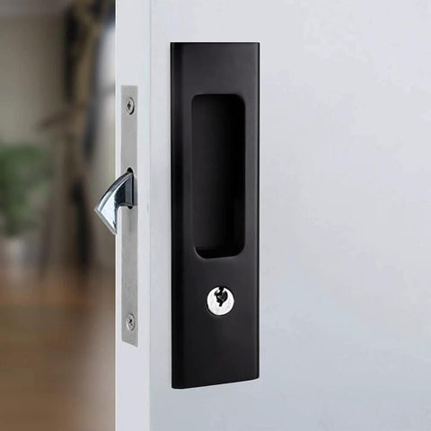 Matte black 6.3 inch recessed pocket sliding door handle with key installed on a white door; zinc alloy construction