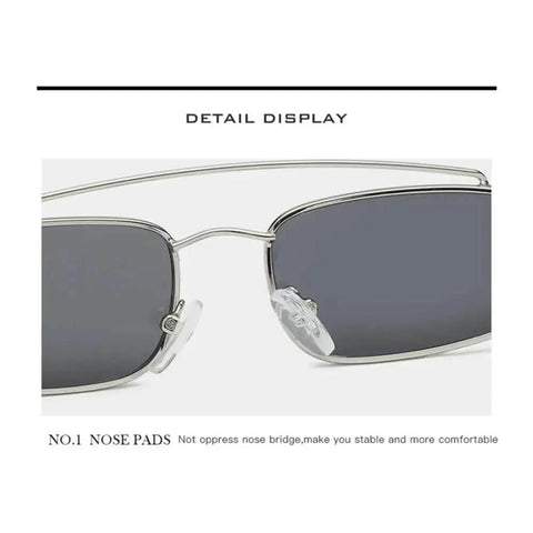 Close-up of sunglasses with slim metal frame and comfortable nose pads, part of Cat Eye Small Frame Sunglasses For Women And Men Unisex Red Pink One Size UV Protection Dope Cool Sun Glasses For Driving Walking Work Travel And Everyday Wear.
